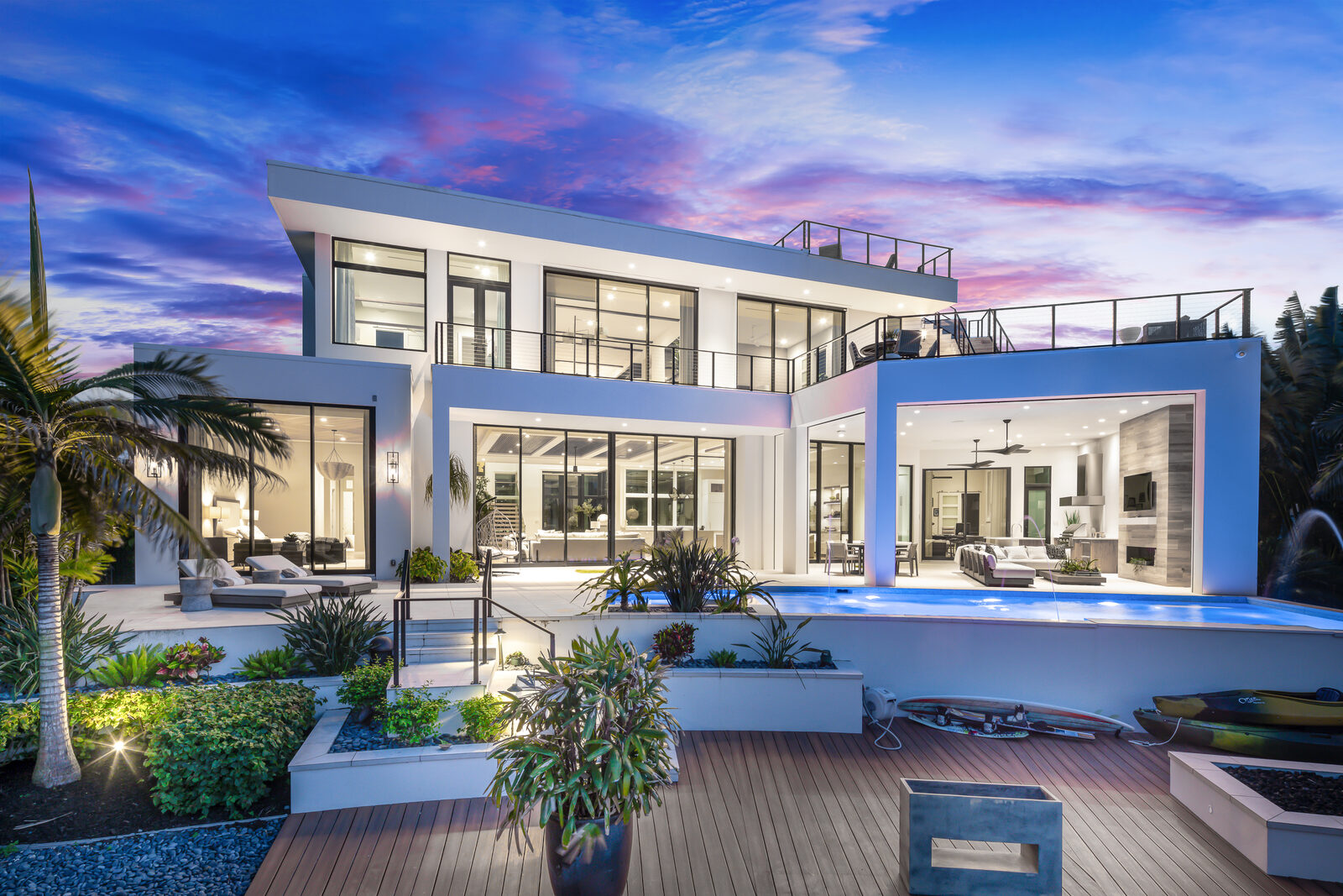 Modern luxury waterfront development at dusk showcasing quality construction